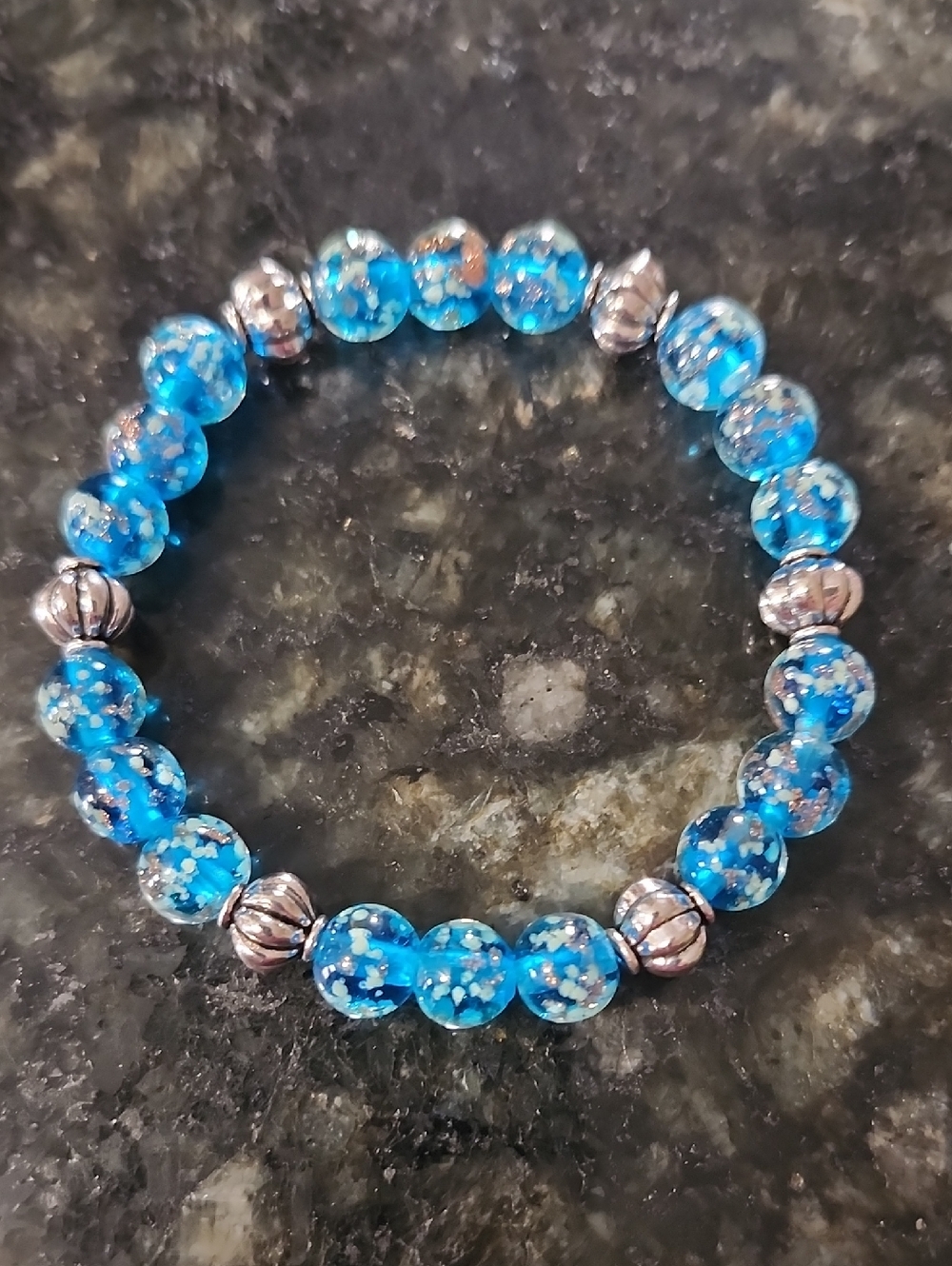 Handmade Glow In Dark Bead Stretch Bracelet in Bright Blue with Silver Accents
